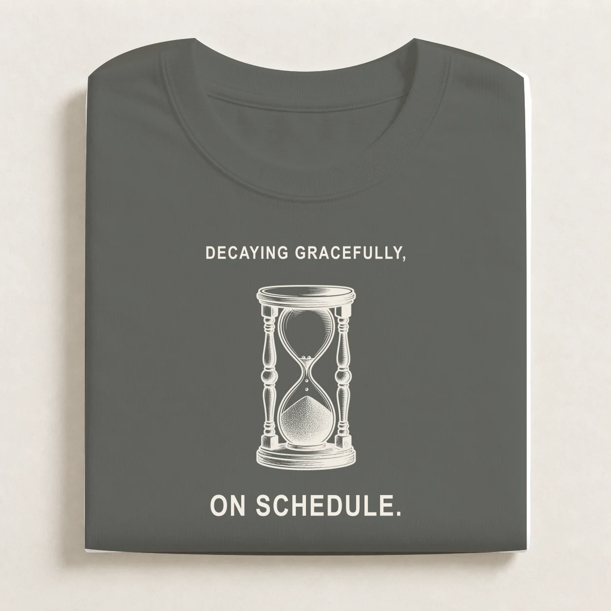 Half-Life printed on a folded Charcoal T-shirt.