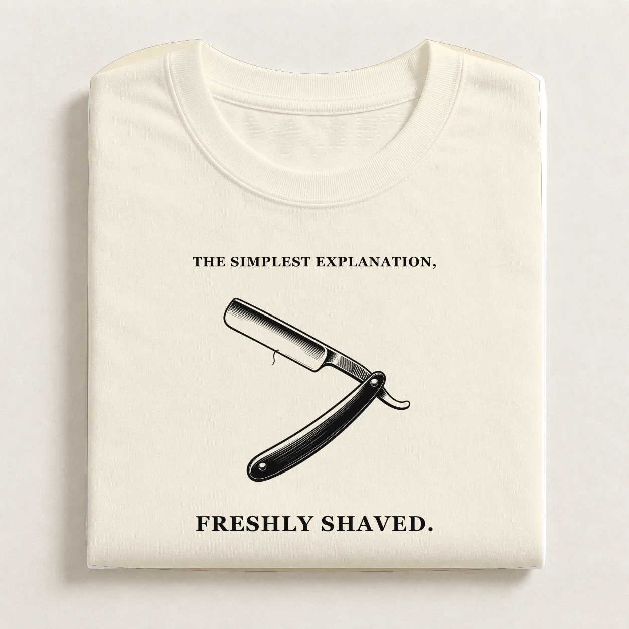 Occam's Razor printed on a folded Natural T-shirt.