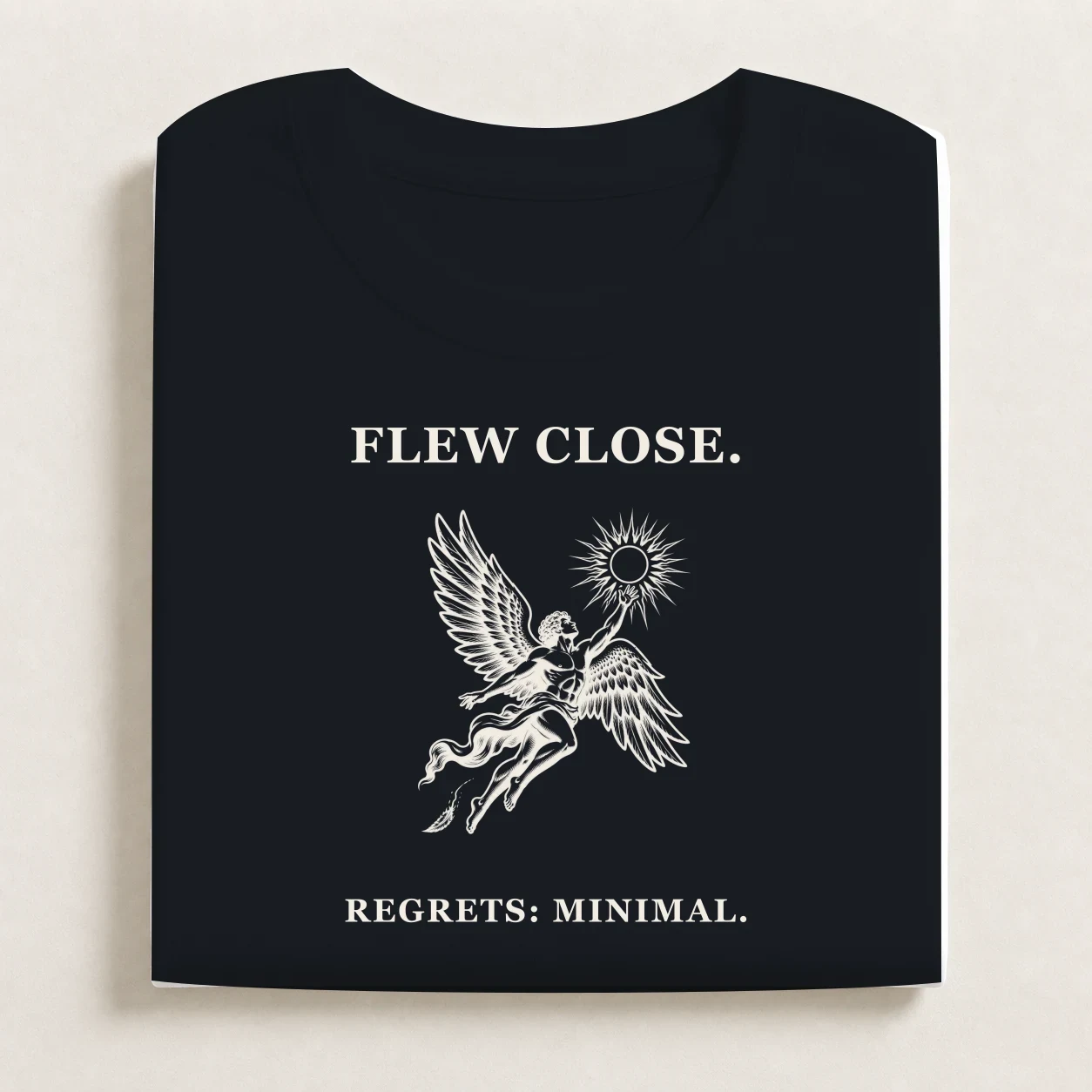 Icarus printed on a folded Navy T-shirt.