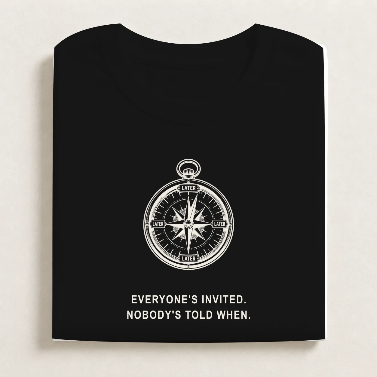 Vague Plans printed on a folded Black T-shirt.